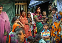 Rights Group: Rohingya Insurgents Massacred Myanmar Hindus Hindu refugees stand outside their make shift shelters at Kutupalong refugee camp in January near Cox's bazar, Bangladesh. Photo: Manish Swarup / Associated Press