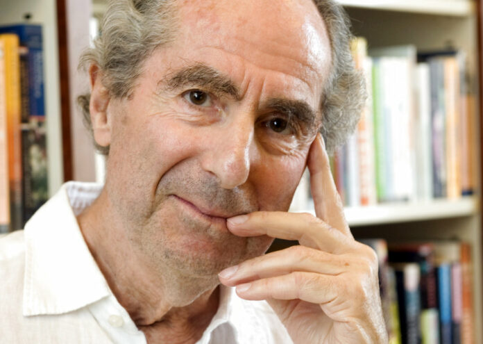 Author Philip Roth poses for a photo in the offices of his publisher in 2008 in Houghton Mifflin, in New York. Photo: Richard Drew / Associated Press