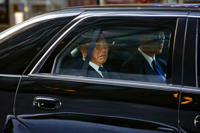 North Korea's Kim Yong Chol, left, leaves a hotel Wednesday in New York. Photo: Andres Kudacki / Associated Press