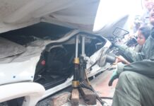 Man Recounts Escape from Car Flattened by Lorry (Video) Rescue workers at the site of the Sunday accident in Bangkok.