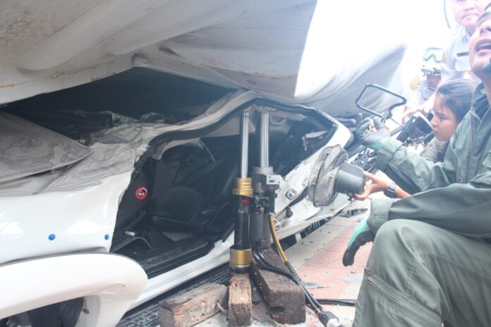 Rescue workers at the site of the Sunday accident in Bangkok.