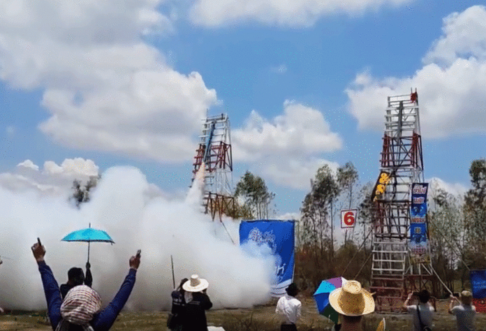 A rocket ignites for launch at Yasothon's Rocket Festival in May 2015.
