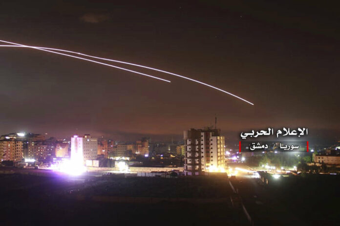 This photo provided early Thursday by the government-controlled Syrian Central Military Media shows missiles rise into the sky as Israeli missiles hit air defense position and other military bases, in Damascus, Syria. Photo: Syrian Central Military Media