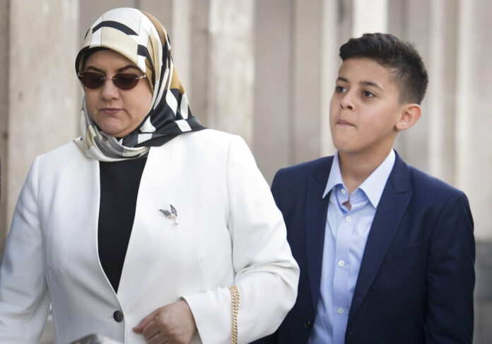 Fatima Boudchar and her son Abderrahim Belhaj, 14, arrive at the Houses of Parliament in London on Thursday. Photo: Stefan Rousseau / PA