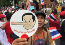 Junta ‘Afraid’ to Lift Politics Ban, But Why? Protesters prepare for a march to the Government House in May 2018 to mark the fourth anniversary of the 2014 coup. They were blocked from reaching their destination.