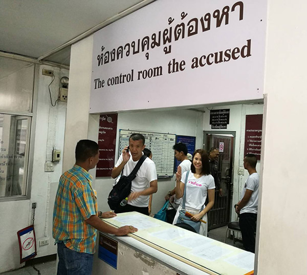 Protest leaders earlier Thursday leaving the Phaya Thai Police Station.