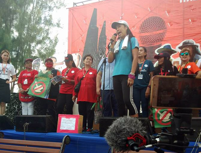 Sasinutta Shinthanawanitch speaks on stage at a pro-democracy rally Saturday at Thammasat University's Tha Prachan campus in Bangkok. Photo: Sasinutta Shinthanawanitch / Facebook