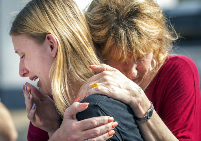 Santa Fe High School student Dakota Shrader is comforted by her mother Susan Davidson following a shooting at the school on Friday. Photo: Stuart Villanueva / The Galveston County Daily News