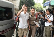 Activists Filed False Treason Complaint Against Army Chief: Junta Ekachai Hongkangwan flashes the anti-junta ‘three-finger salute’ in May as he arrives at a Bangkok court.