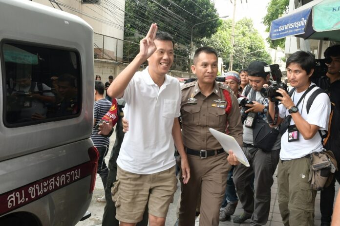 Ekachai Hongkangwan flashes the anti-junta ‘three-finger salute’ in May as he arrives at a Bangkok court. Ekachai Hongkangwan flashes the anti-junta ‘three-finger salute’ in May as he arrives at a Bangkok court.