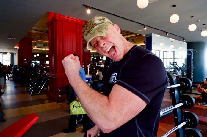 Sgt. Ken Weichert flexes his left bicep Friday in Bangkok. Sgt. Ken Weichert flexes his left bicep Friday in Bangkok.