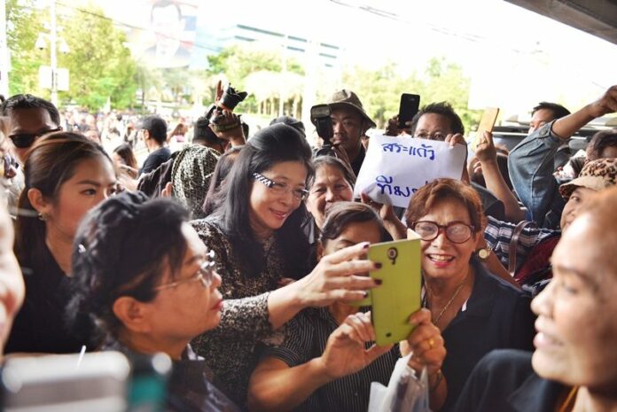 Sudarat Keyuraphan poses for a photo with her supporters on Aug. 25 in Bangkok