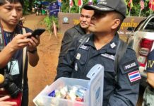 Food, Notes Dropped into Cave as Prospects Dwindle Col. Phop Mulchet, chief of Koh Chang Police in Mae Sai, on Friday holds a container of food and drinking water.