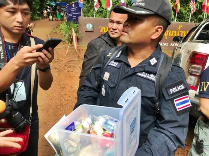 Col. Phop Mulchet, chief of Koh Chang Police in Mae Sai, on Friday holds a container of food and drinking water.