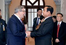 EU Says Time Running Out to Observe Thai Elections Pirkka Tapiola, EU ambassador to Thailand, shakes hands with Gen. Prayuth Chan-ocha on April 25 at Government House.