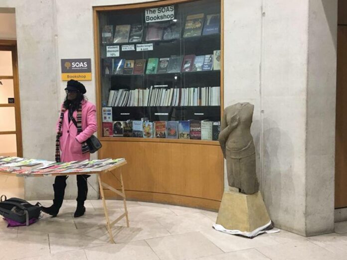 A 13th century Buddha figure of Thai origin stands inside the Brunei Gallery building of the School of Oriental and African Studies on March 22. Photo: Angela Chiu / Courtesy