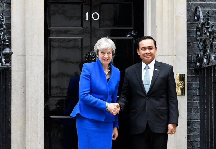 Prime minister Prayuth Chan-ocha shakes hand with his British counterpart, Theresa May, on June 20 at 10 Downing Street in London. Photo: Government House