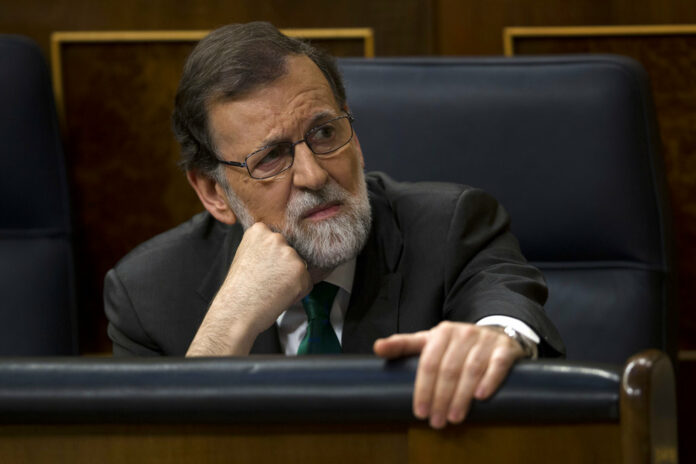 Spain's Prime Minister Mariano Rajoy and Popular Party leader listens to speeches during the first day of a motion of no confidence session Thursday at the Spanish parliament in Madrid. Photo: Francisco Seco / Associated Press