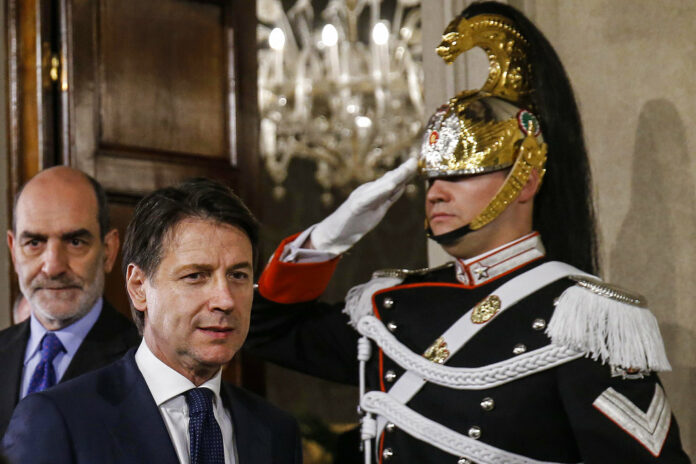 Giuseppe Conte arrives to address the media at the Quirinale presidential palace Thursday in Rome. Photo: Fabio Frustaci / Associated Press Giuseppe Conte arrives to address the media at the Quirinale presidential palace Thursday in Rome. Photo: Fabio Frustaci / Associated Press