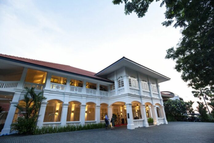 An entrance glows outside the Capella Hotel on Sentosa Island in Singapore Tuesday, June 5, 2018. U.S. Photo: Yong Teck Lim / Associated Press