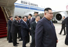 Kim Jung Un Just Landed in Singapore. Here Are the Photos. In this photo released by the Ministry of Communications and Information of Singapore, North Korean leader Kim Jong Un, right, arrives at the Changi International Airport on Sunday.