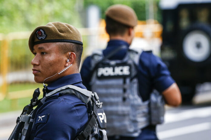 Gurkha police officers guard the perimeter of the Shangri-La Hotel in Singapore, Sunday. Photo: Yong Teck Lim / Associated Press