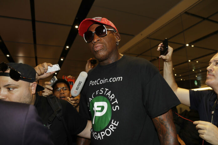 Former NBA basketball player Dennis Rodman arrives at Singapore's Changi Airport on Tuesday, June 12, 2018. Photo: Wong Maye-E / Associated Press