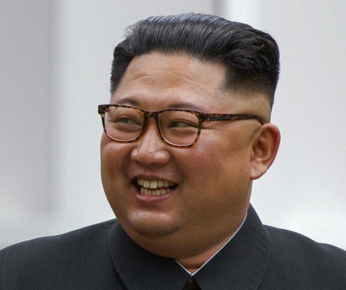 North Korean leader Kim Jong Un smiles while walking with U.S. President Donald Trump in June on Sentosa Island in Singapore. Photo: Evan Vucci / Associated Press