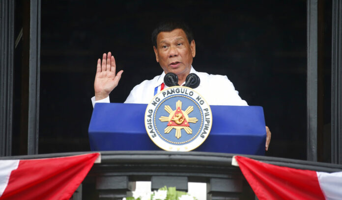 Philippine President Rodrigo Duterte gestures while addressing the crowd after leading the flag-raising rites at the 120th Philippine Independence Day celebration in June at the Emilio Aguinaldo Shrine at Kawit, Cavite province south of Manila, Philippines. Photo: Bullit Marquez / Associated Press
