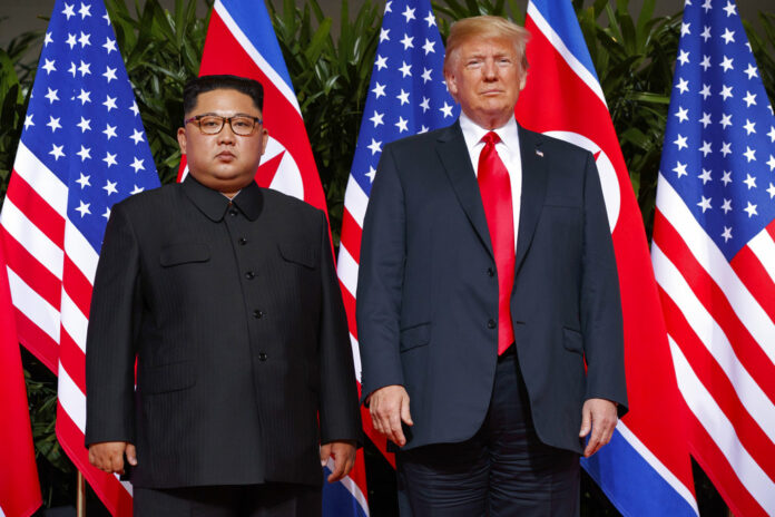 U.S. President Donald Trump meets with North Korean leader Kim Jong Un in June on Sentosa Island, in Singapore. Photo: Evan Vucci / Associated Press