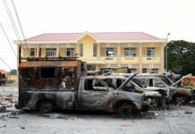 Vietnam Arrests 8 People After Economic Zone Law Protests A row of charred vehicles is seen June 12 at the fire and police station in the south central province of Binh Thuan, Vietnam. Photo: Associated Press