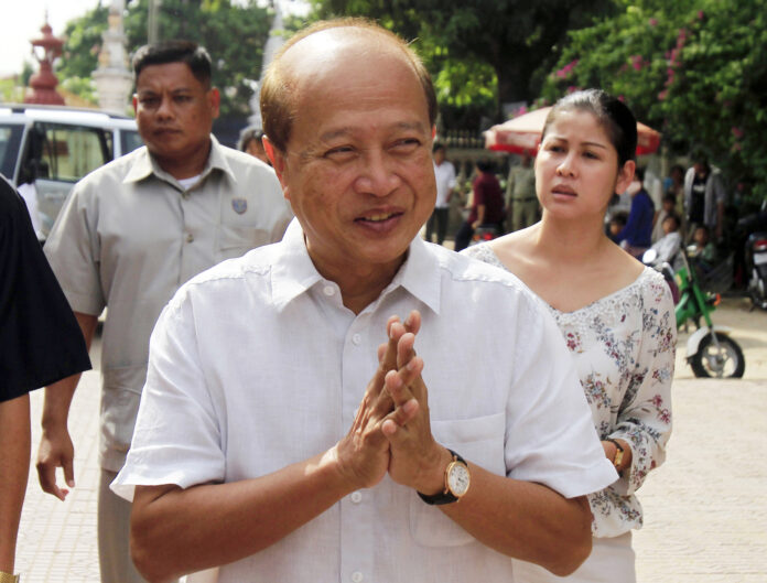 In this Sunday, June 3, 2012, file photo, Cambodian Prince Norodom Ranariddh greets people before casting his ballot in a local elections at the Wat Than temple in Phnom Penh, Cambodia. Ranariddh, 74, has been seriously injured in a road crash that killed his wife and injured at least seven other people early Sunday. Photo: Heng Sinith / Associated Press