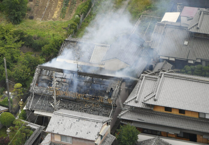 Smoke rises from a house blaze in Takatsuki, Osaka. A 6.1 earthquake shook the city of Osaka in western Japan on Monday morning, causing scattered damage including broken glass and partial building collapses. Photo: Kyodo News via AP