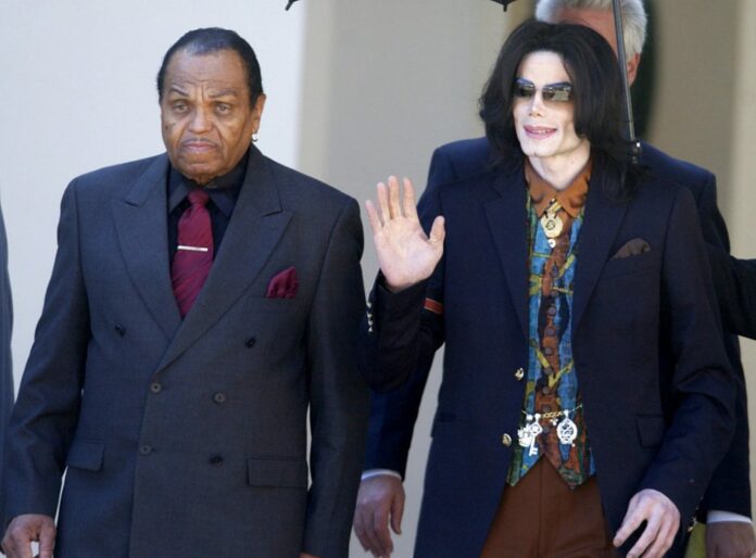 FILE - In this March 15, 2005 file photo, Pop star Michael Jackson leaves the Santa Barbara County Courthouse with his father, Joe, in Santa Maria, following a day of testimony in Jackson's trial on charges of child molestation. Photo: Michael A. Mariant / Associated Press