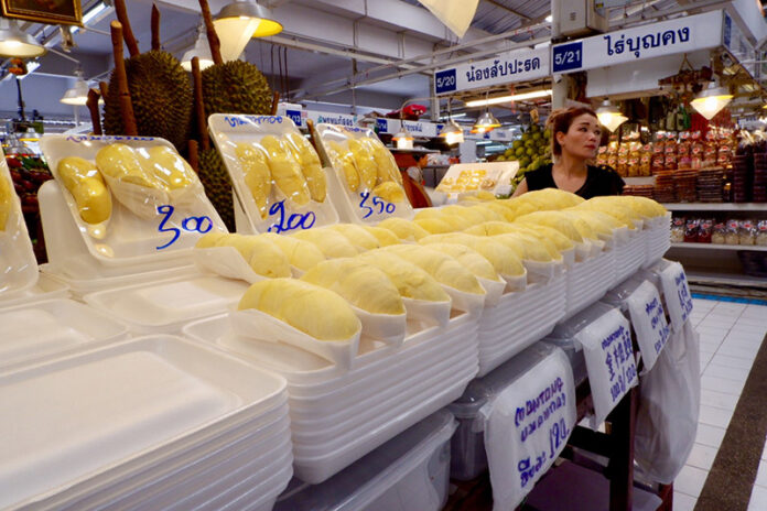 Piles of Styrofoam trays await durian-hungry customers Tuesday at the Or Tor Kor Market in Bangkok.