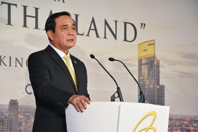 Junta chairman Prayuth Chan-ocha speaks at a public event in London. Photo: Government House
