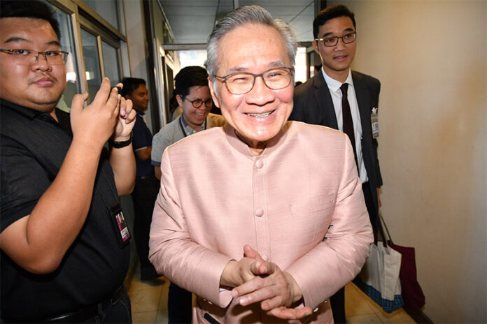 Foreign Minister Don Pramudwinai smile to reporters Tuesday when asked about his job security.