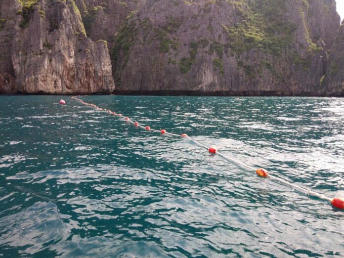 A line of buoys marks the closest points boats can approach Maya Beach from the bay for the next four months. A line of buoys marks the closest points boats can approach Maya Beach from the bay for the next four months.