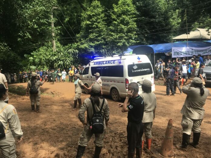 An ambulance parks at the entrance to Tham Luang Cave on Friday afternoon.