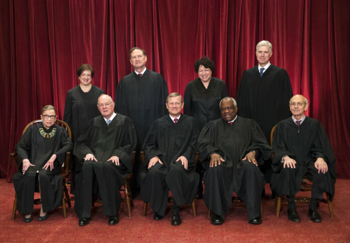 The justices of the U.S. Supreme Court gather for an official group portrait. Photo: J. Scott Applewhite / Associated Press