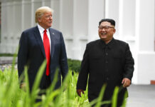 Trump-Kim Summit Ends With Signing Unspecified Document U.S. President Donald Trump and North Korea leader Kim Jong Un walk from their lunch Tuesday at the Capella resort on Sentosa Island. Photo: Evan Vucci / Associated Press