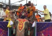 Ceremonies Kick Off Nationwide to Mark Buddhist Lent Monks mount an elephant Friday in Surin province. Photo: Matichon