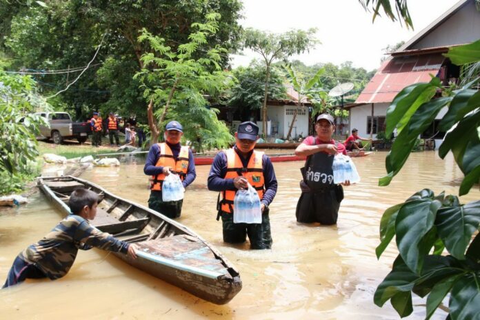Rescue workers deliver water Tuesday to residents affected by flooding in Ubon Ratchathani province. Rescue workers deliver water Tuesday to residents affected by flooding in Ubon Ratchathani province.