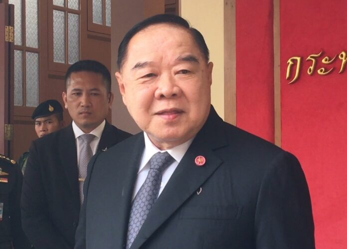Prawit Wongsuwan speaks to reporters on June 29.
