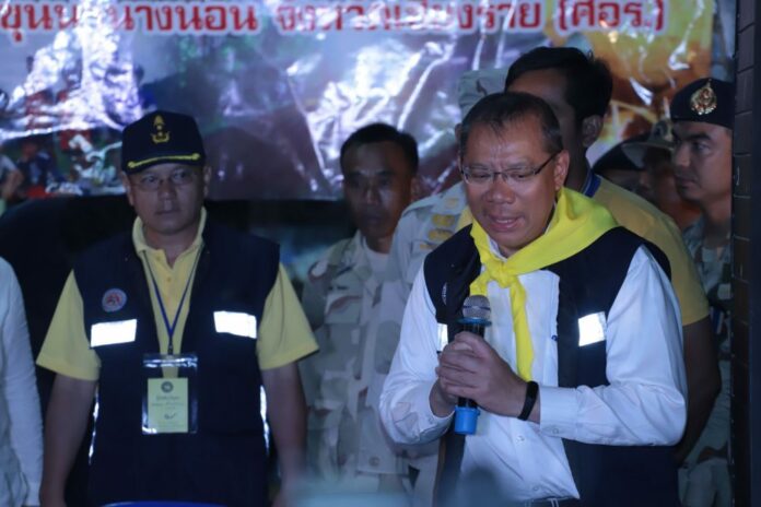 Former Chiang Rai Gov. Narongsak Osottanakorn speaks to reporters Friday night outside Luang cave.