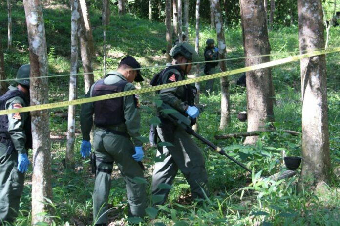EOD team scans the area for evidence Monday morning.