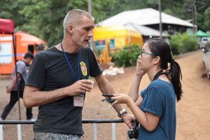 Reporter Jintamas Saksornchai, at right, interviews a Danish expat volunteer diver.