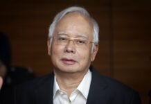 Malaysian Ex-PM Slapped With New Charge Over 1MDB Scandal Former Malaysian Prime Minister Najib Razak in May arrives at Malaysian Anti-Corruption Commission (MACC) Office in July in Putrajaya, Malaysia. Photo: Vincent Thian / Associated Press