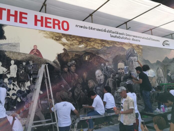 Artists Saturday paint a mural dedicated to the international rescue effort that affected the safe extraction of 13 people from a flooded cave in Chiang Rai province. Artists Saturday paint a mural dedicated to the international rescue effort that affected the safe extraction of 13 people from a flooded cave in Chiang Rai province.