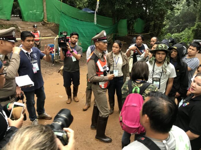 Police tell reporters to leave the cave site.